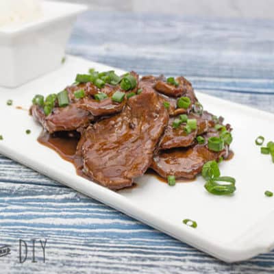 mongolian beef on a white plate