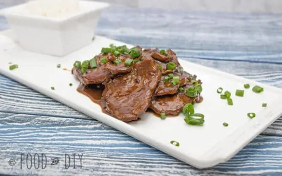 mongolian beef on a white plate