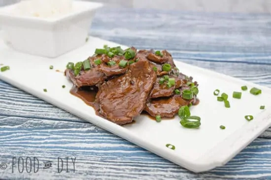 mongolian beef on a white plate