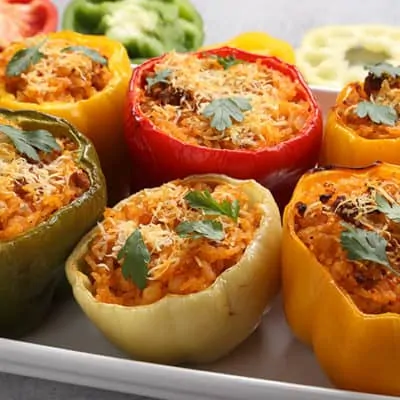 Spicy stuffed bell peppers in a white dish