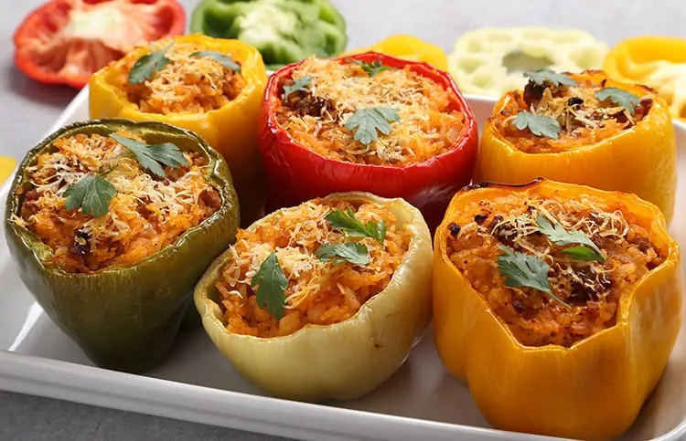 Spicy stuffed bell peppers in a white dish