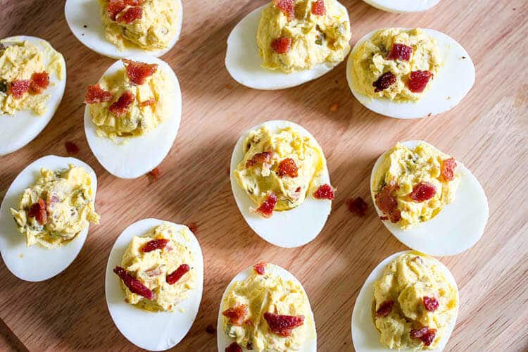 PERFECT boiled eggs turned into the BEST deviled eggs with bacon and Jalapeños. Make these to bring to your next cookout or potluck!