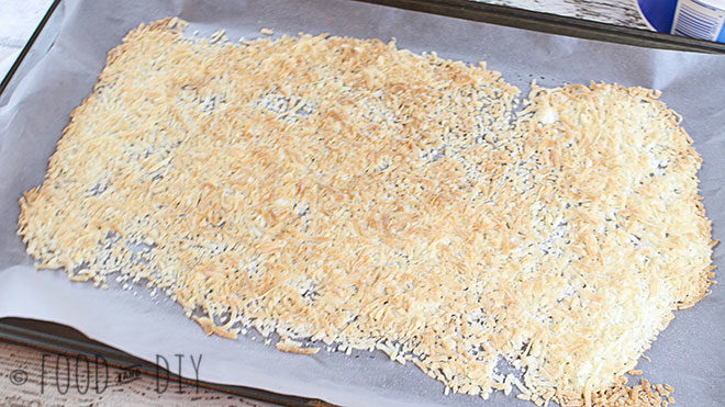 Toasted shredded coconut on wax paper on cookie sheet