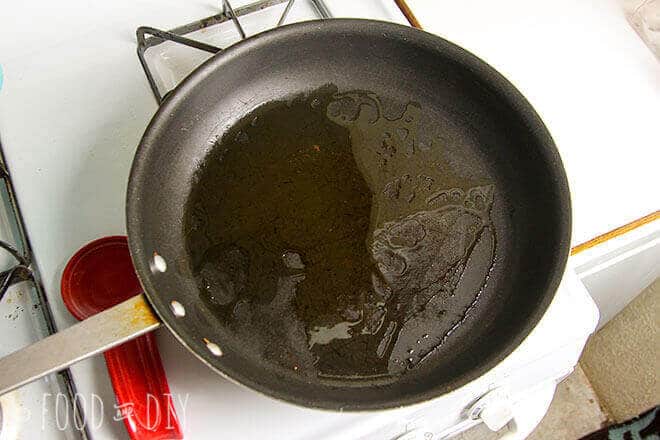 olive oil heating in a skillet
