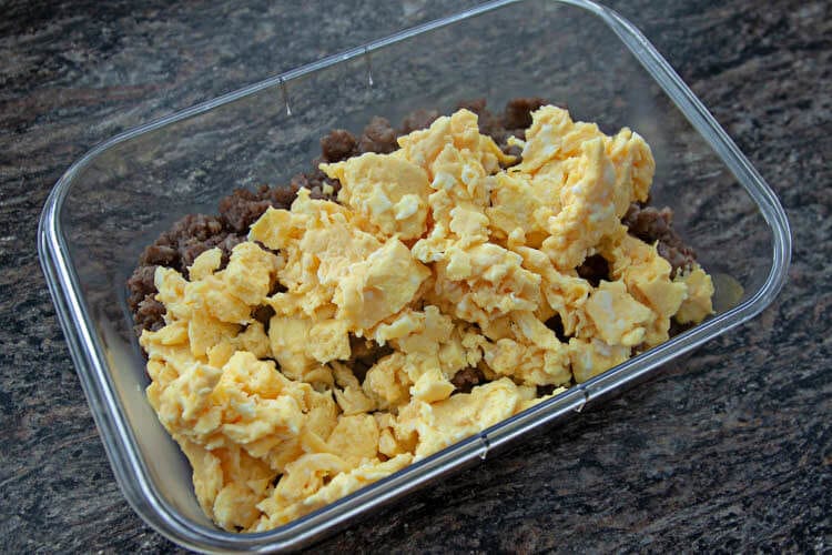 browned sausage & scrambled eggs in plastic storage container
