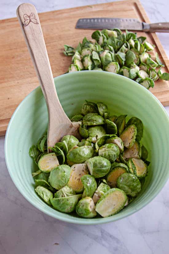 chopped brussels sprouts in a green bowl